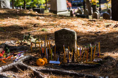 Notes and pens left behind at Author’s Ridge in Sleepy Hollow Cemetery.