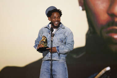 rapper kendrick lamar accepting an award at the 2025 grammys