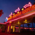 Florida, Vilano Beach, Atlantic Shore, Magic Beach Motel neon sign at dusk.