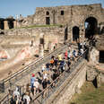 Tourists enter Porta Marina in the Archaeological Park in Pompeii, Italy. 