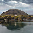 house on lake in Arnarstapi, Iceland