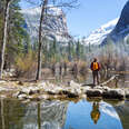 a man looking out into mountains in Yosemite